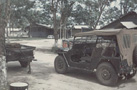 Commo Jeep in front of radio shop